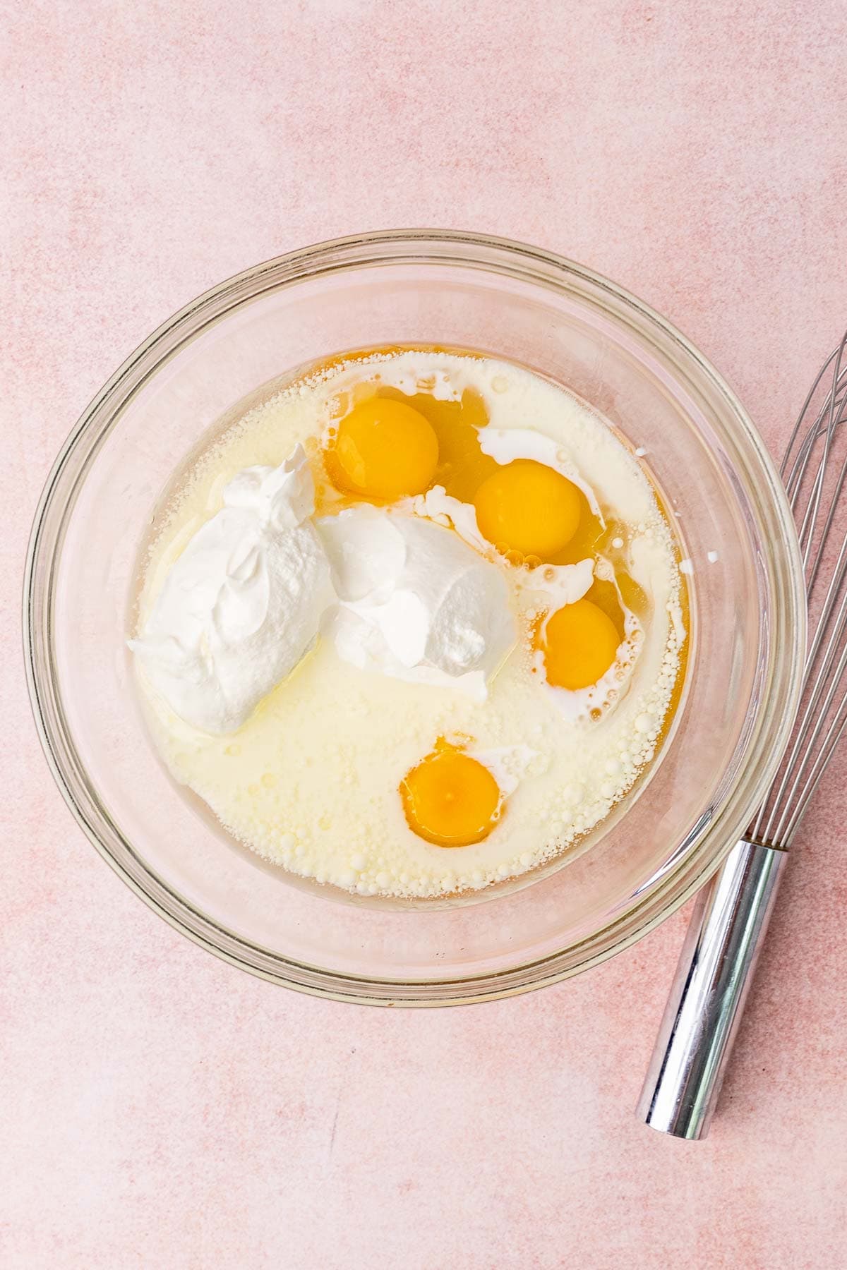 adding eggs to batter