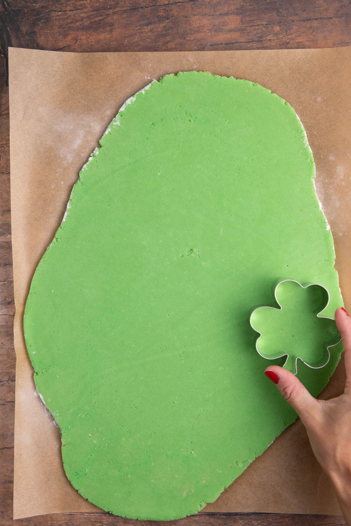 3-leaf clover cookie cutter over flat dough