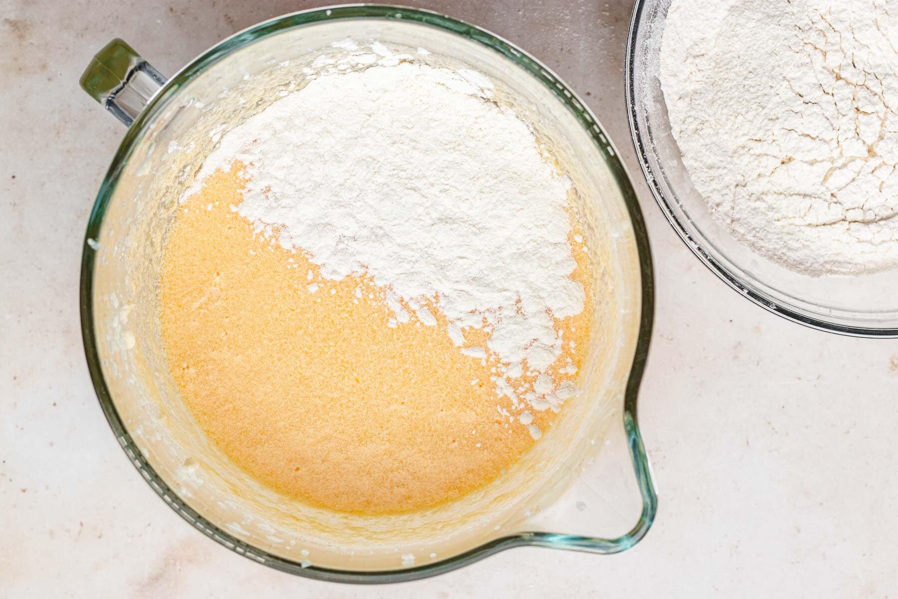 Sour Cream Pound Cake batter with dry ingredients being mixed in