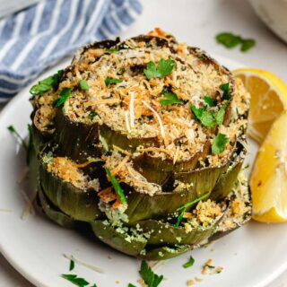 Baked artichoke filled with breadcrumbs and cheese.