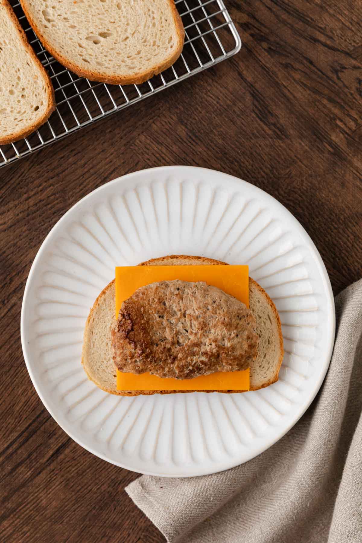 Turkey patty and cheese over bread