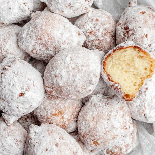Powdered sugar coated donuts.