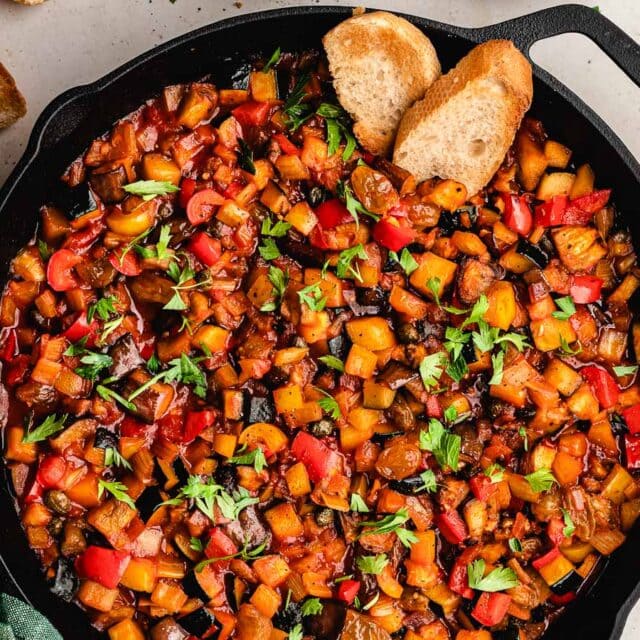 Sweet and savory relish in cast iron skillet with crostini.