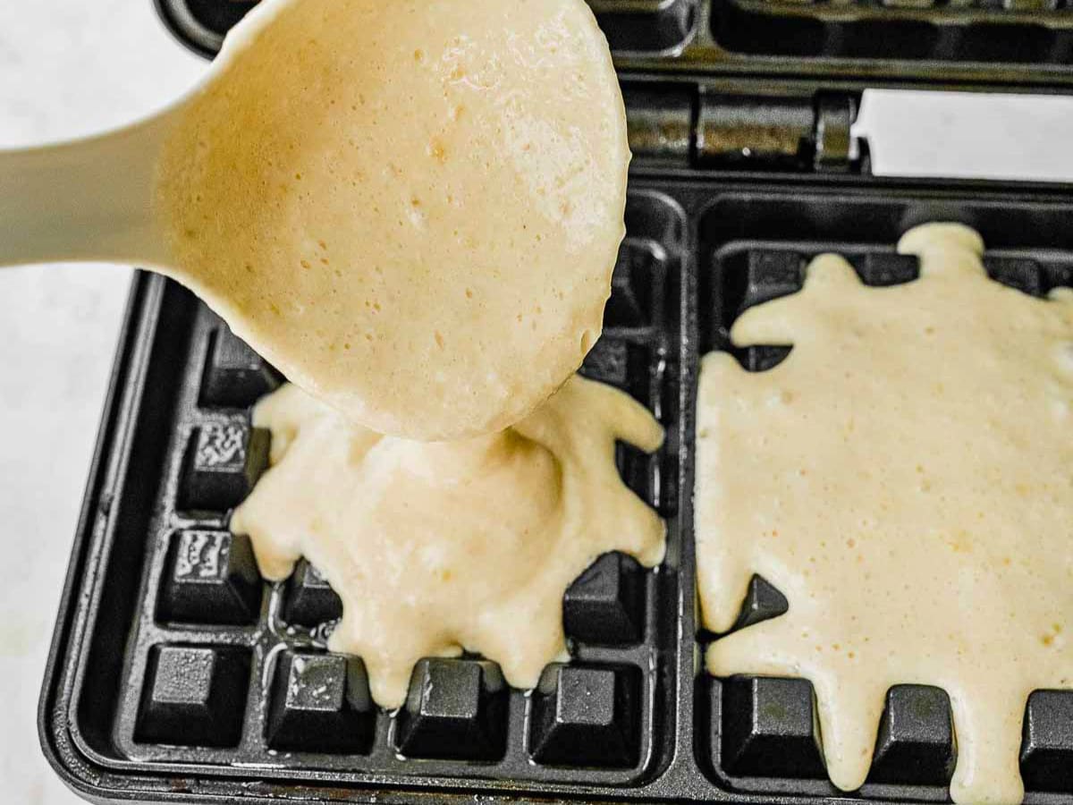 Adding batter to waffle iron
