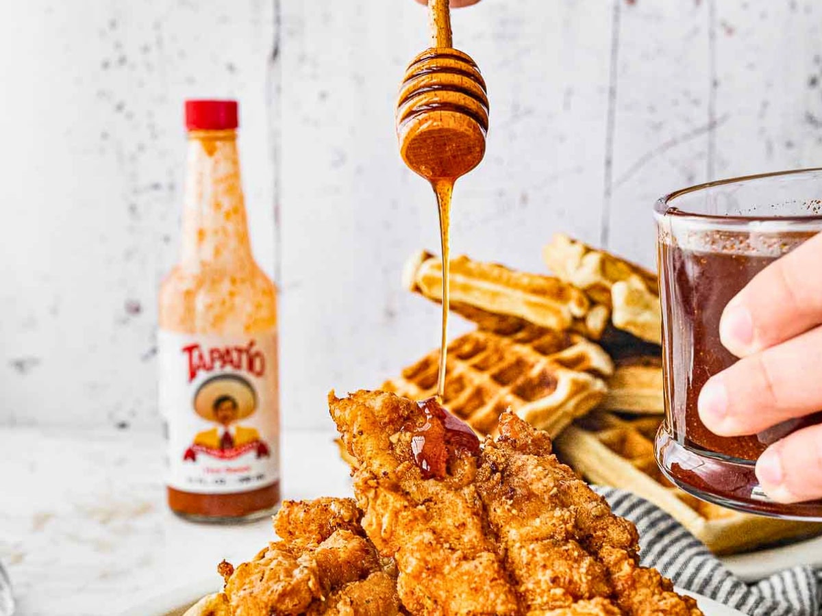 Adding hot honey to waffles