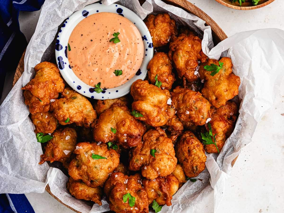 Serving platter with fried seafood fritters.