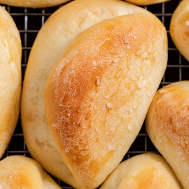 Baked rolls brushed with butter, sprinkled with salt.