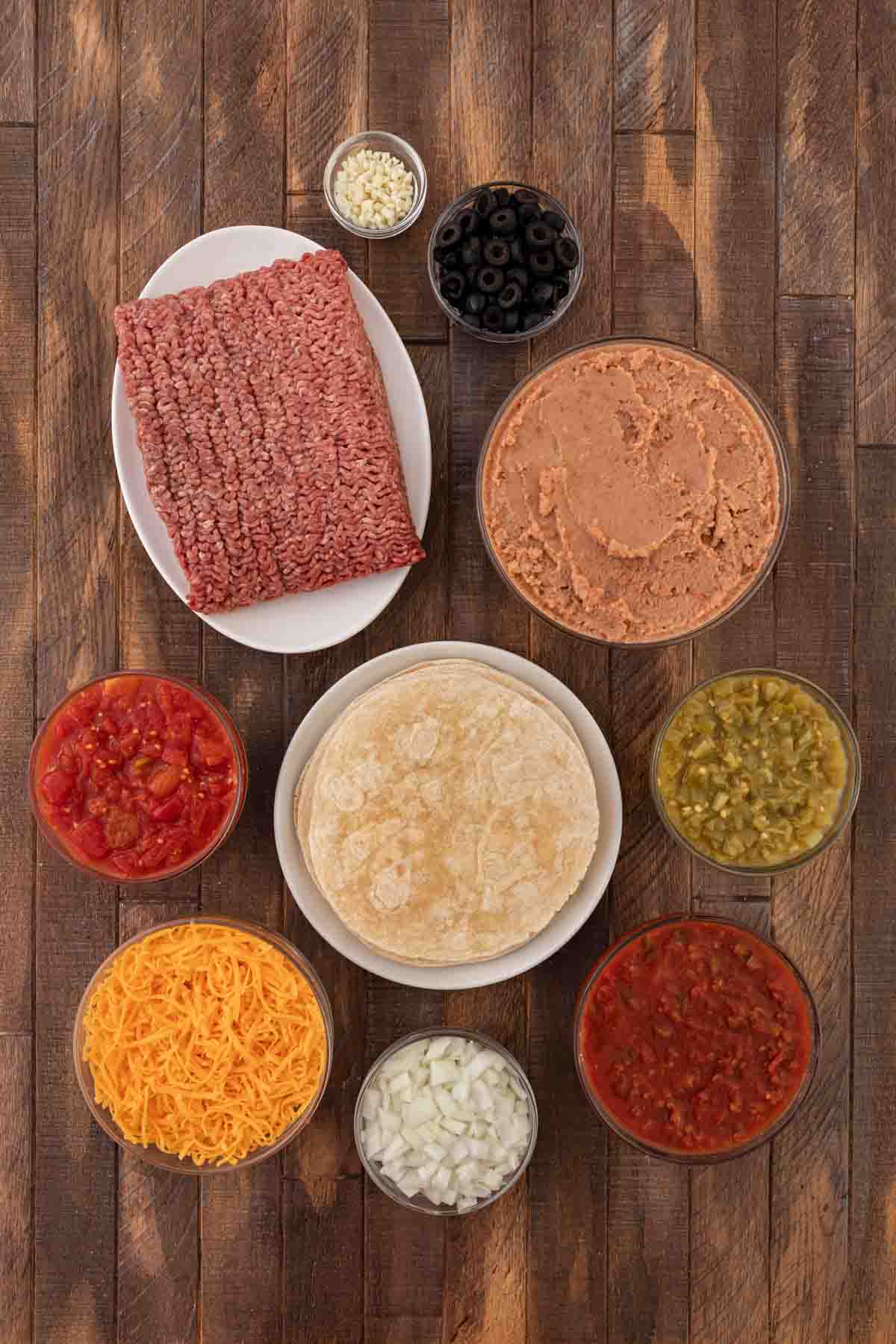 Cheesy Burrito Pie ingredients in bowls