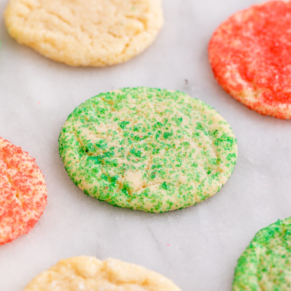 Christmas Sugar Cookies baked cookies on parchment paper