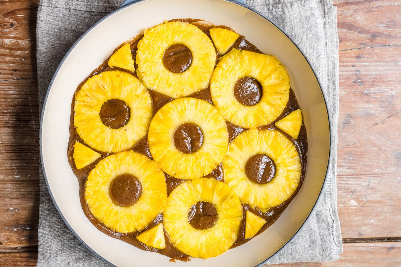 Hali’imaile’s Pineapple Upside Down Cake pineapples in pan