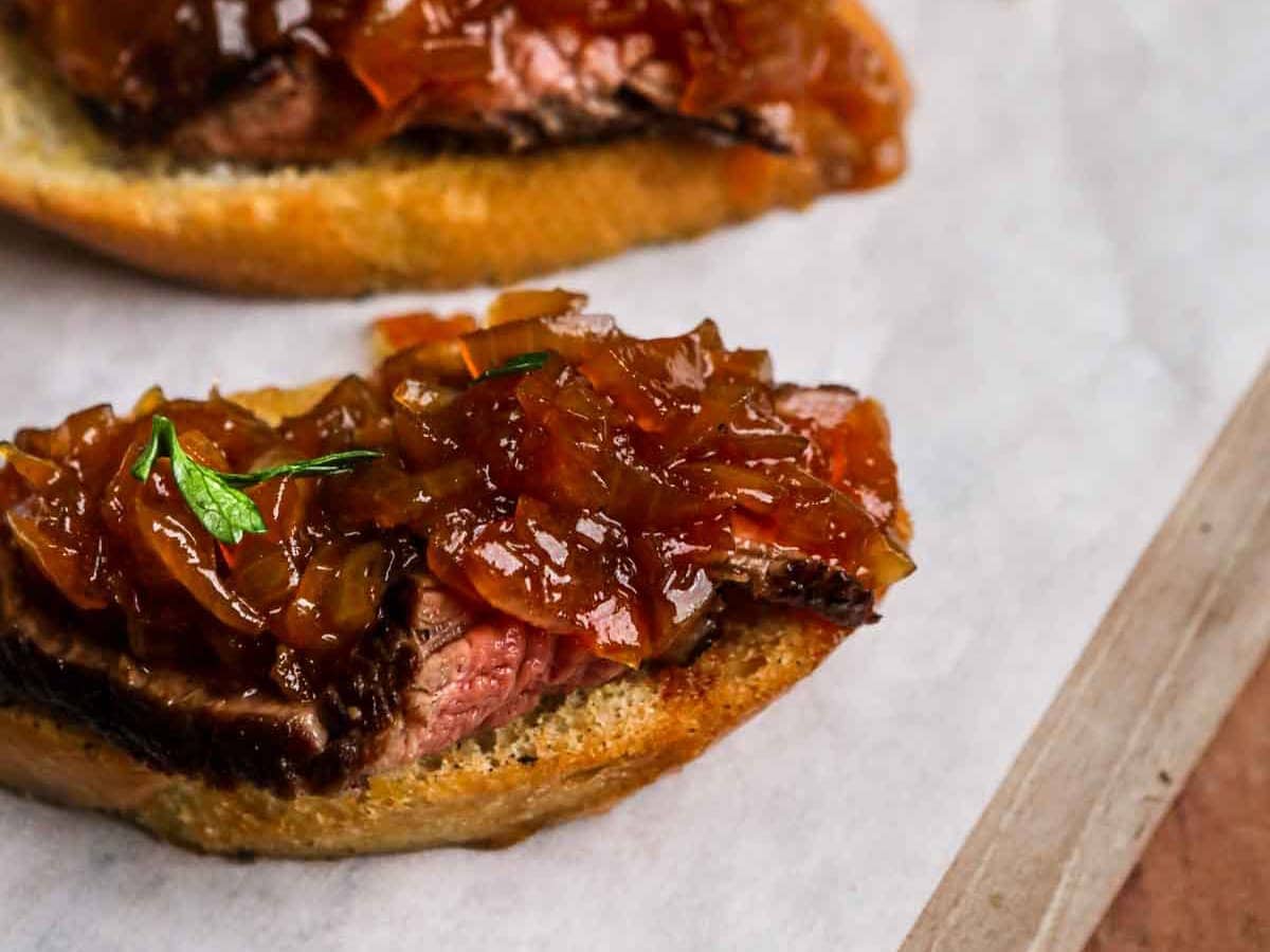 bread with steak topped with jam 