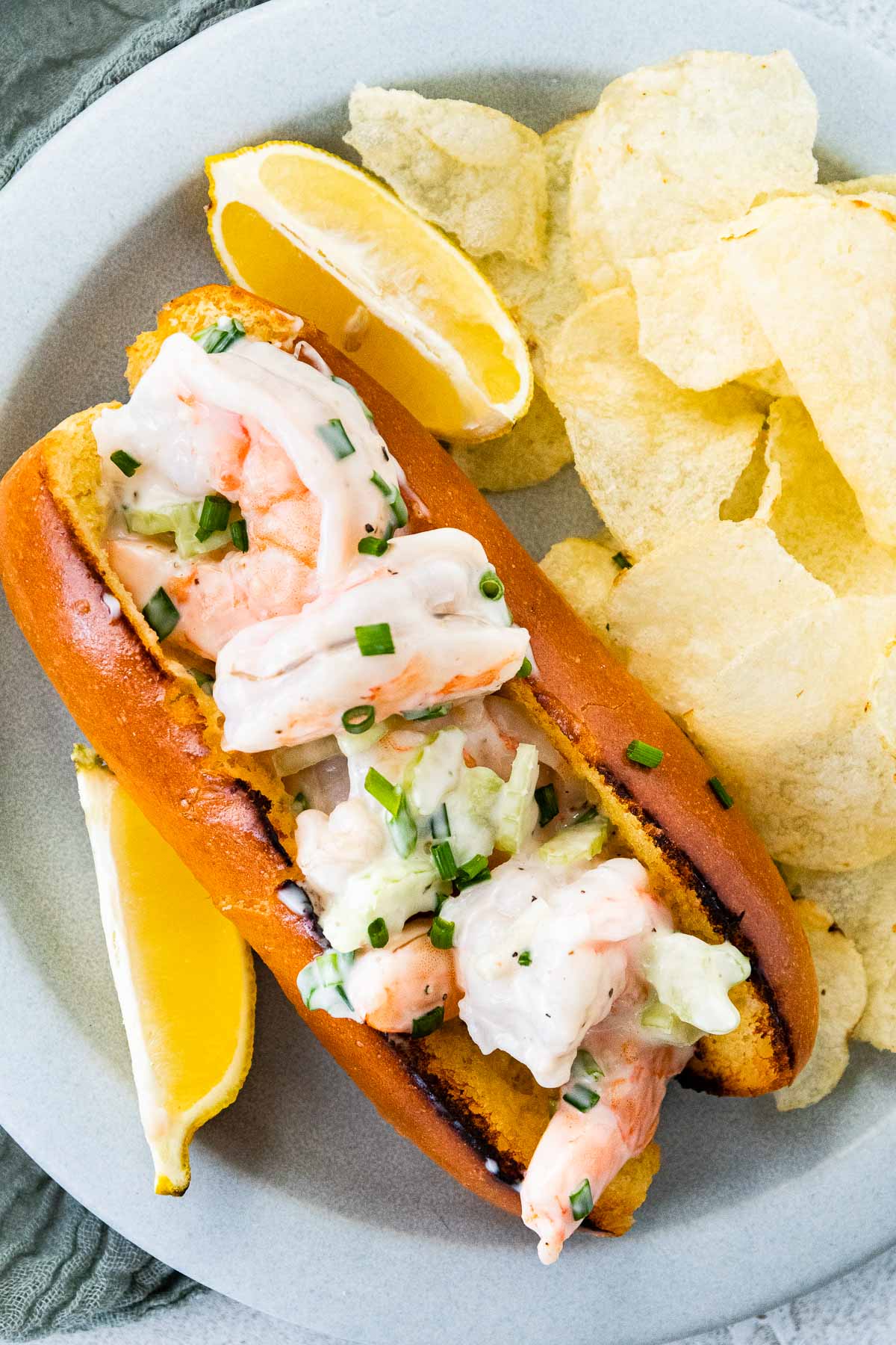 Shrimp Roll on a plate with potato chips