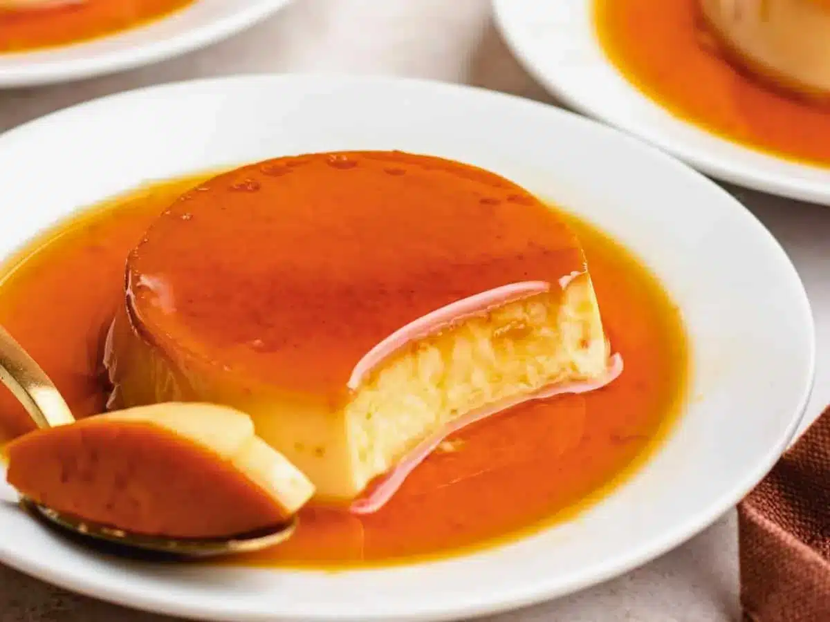 Spoonful taken out of custard caramel