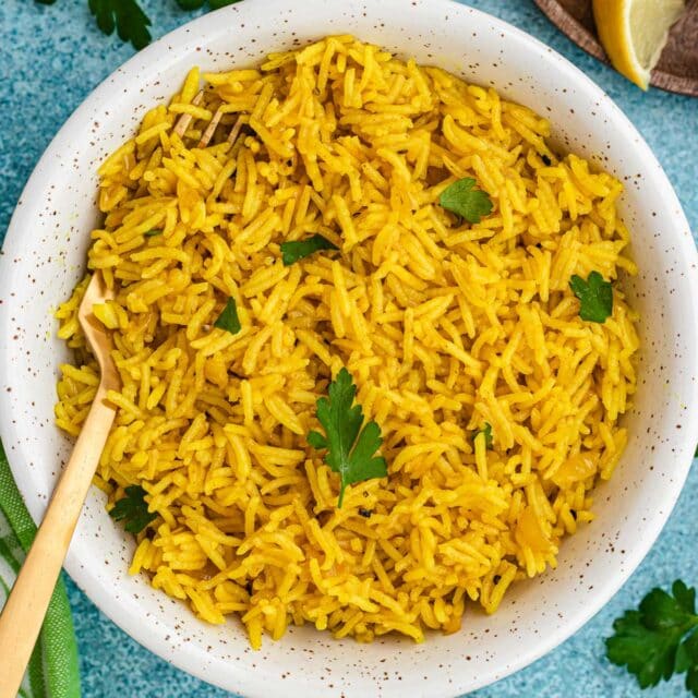 Latin Yellow Rice in bowl garnished with cilantro, 1x1