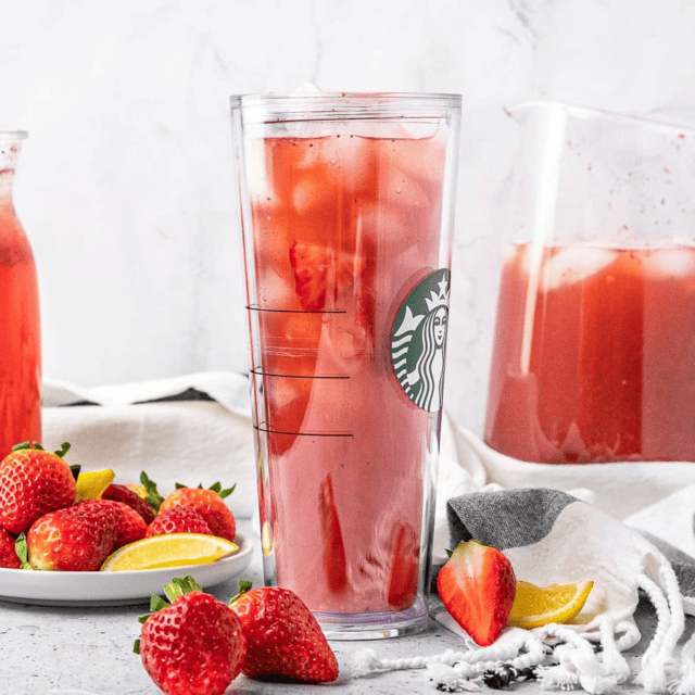 refresher in starbucks glass with plate of lemon and strawberries