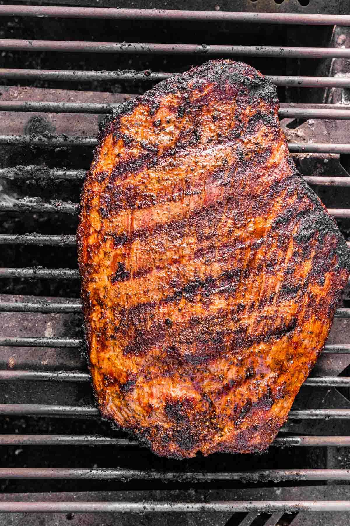 Steak Tacos whole steak cooking on grill