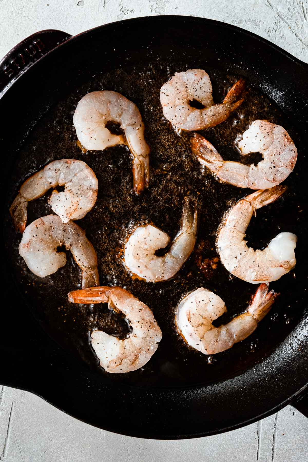 raw shrimp in skillet