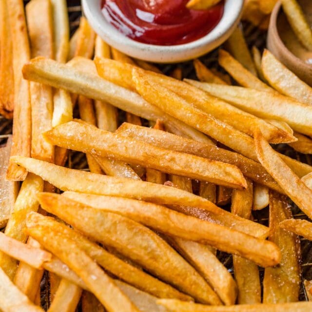 closeup of cooked french fries with ketchup