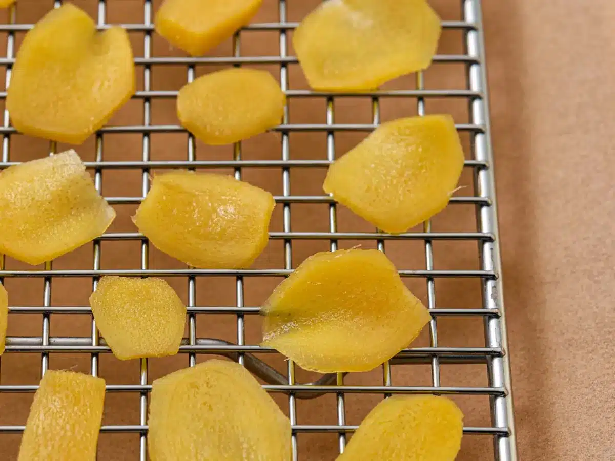 Spicy root slices drying on baking rack.