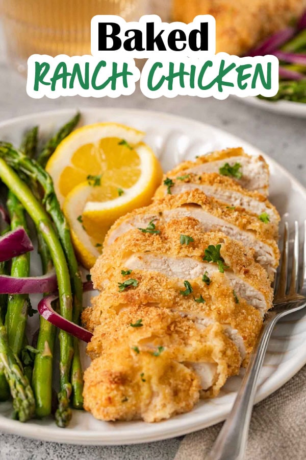 sliced ranch chicken with asparagus and lemon slice on plate