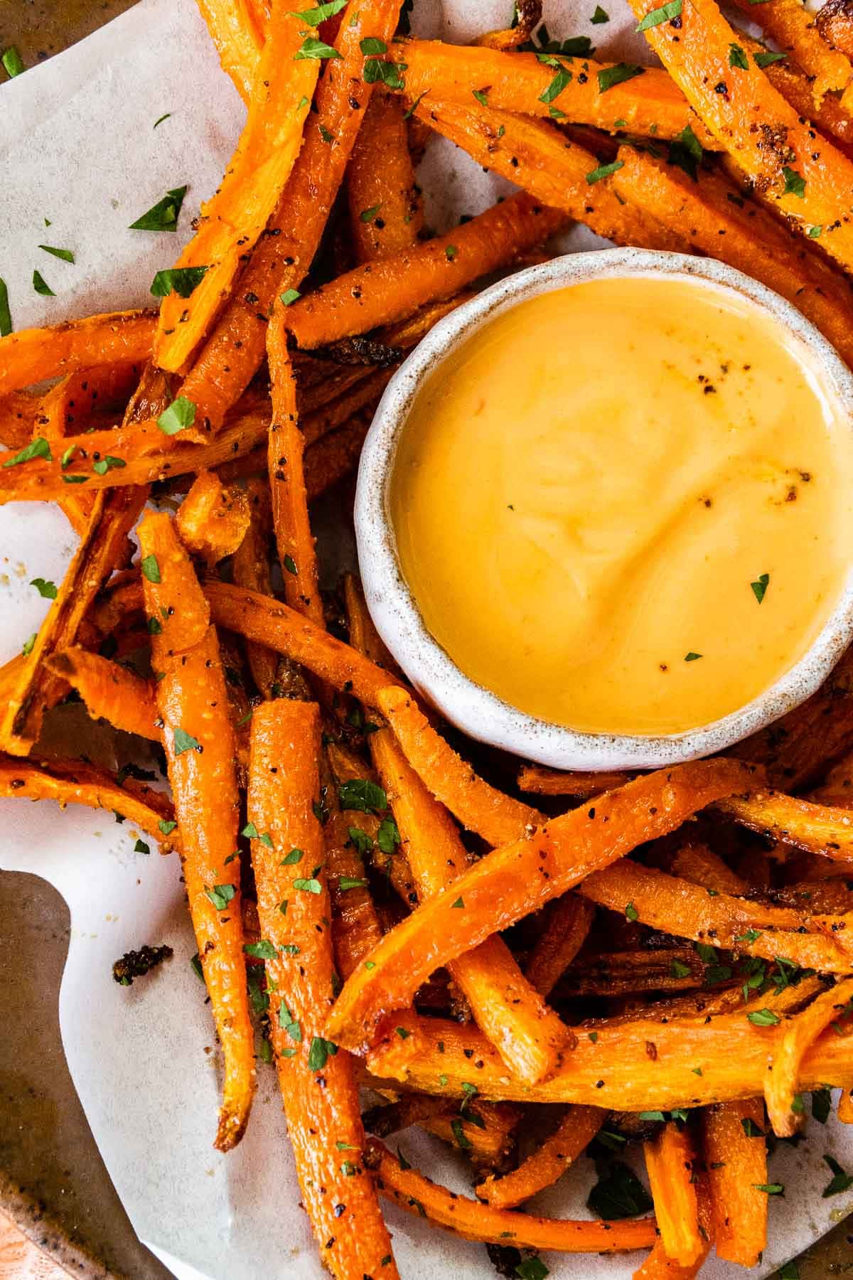 Close up of Roasted Carrot Fries on a plate with dip