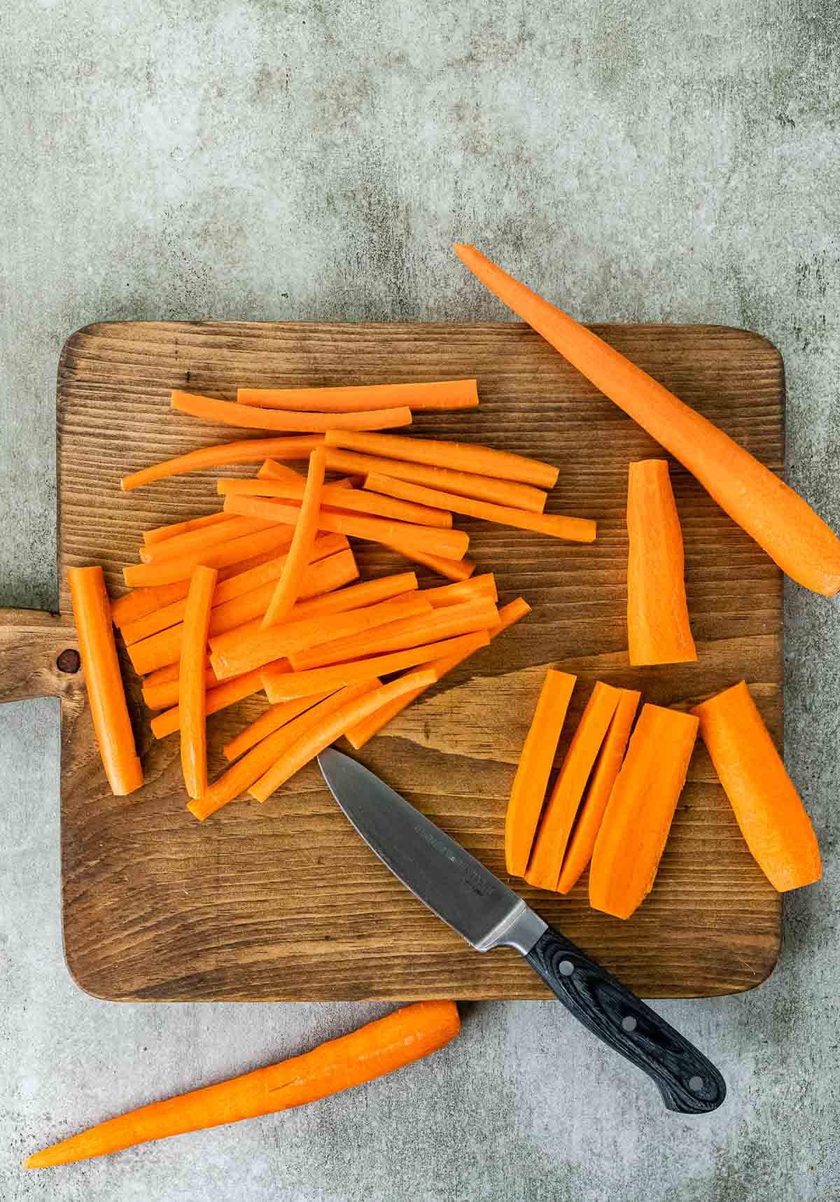 Roasted Carrot Fries, carrot being chopped