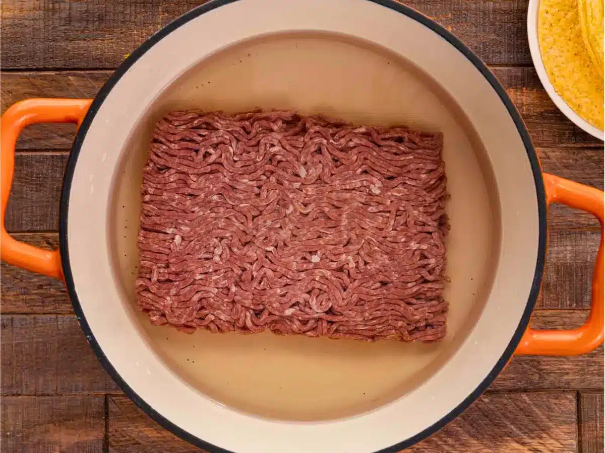 raw hamburger meat in pot