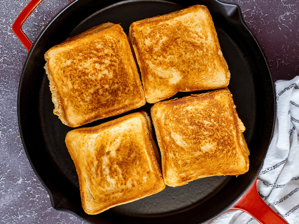 4 pieces of toasted bread on a skillet