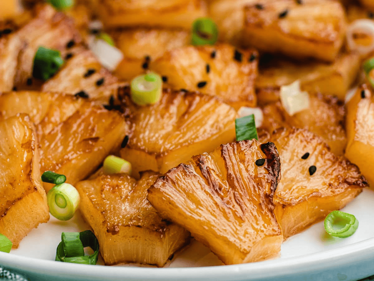 Caramelized Pineapple on a white plate.