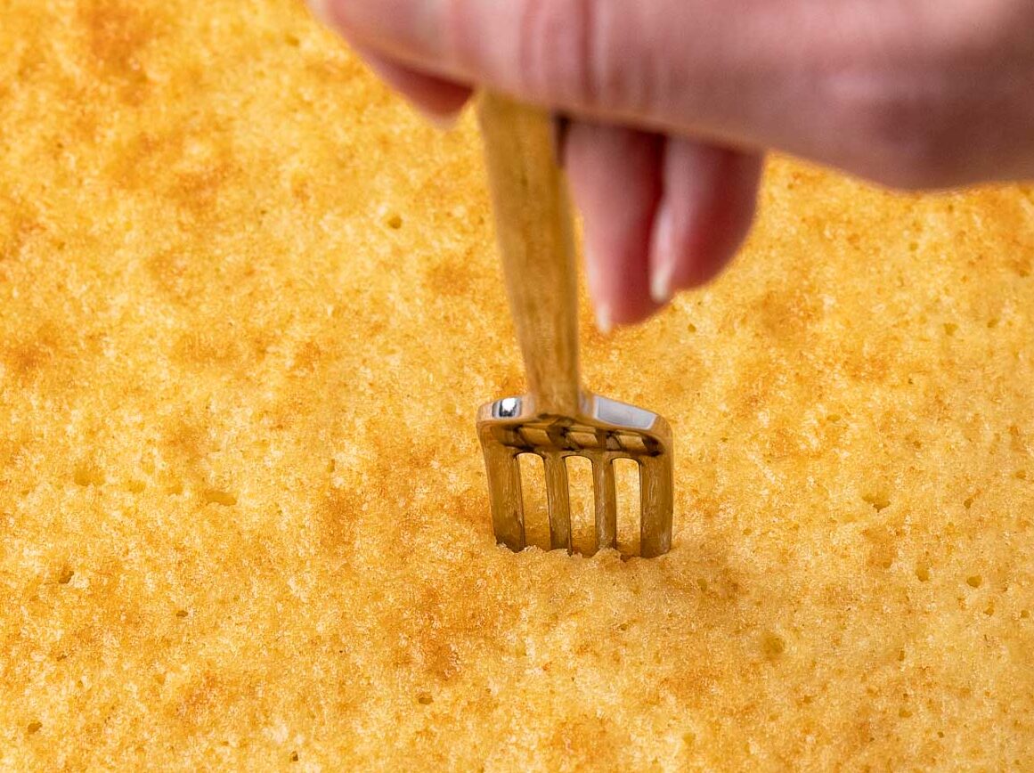 fork poking cake 