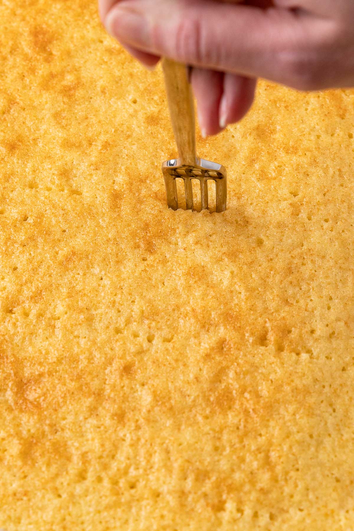 fork poking cake 