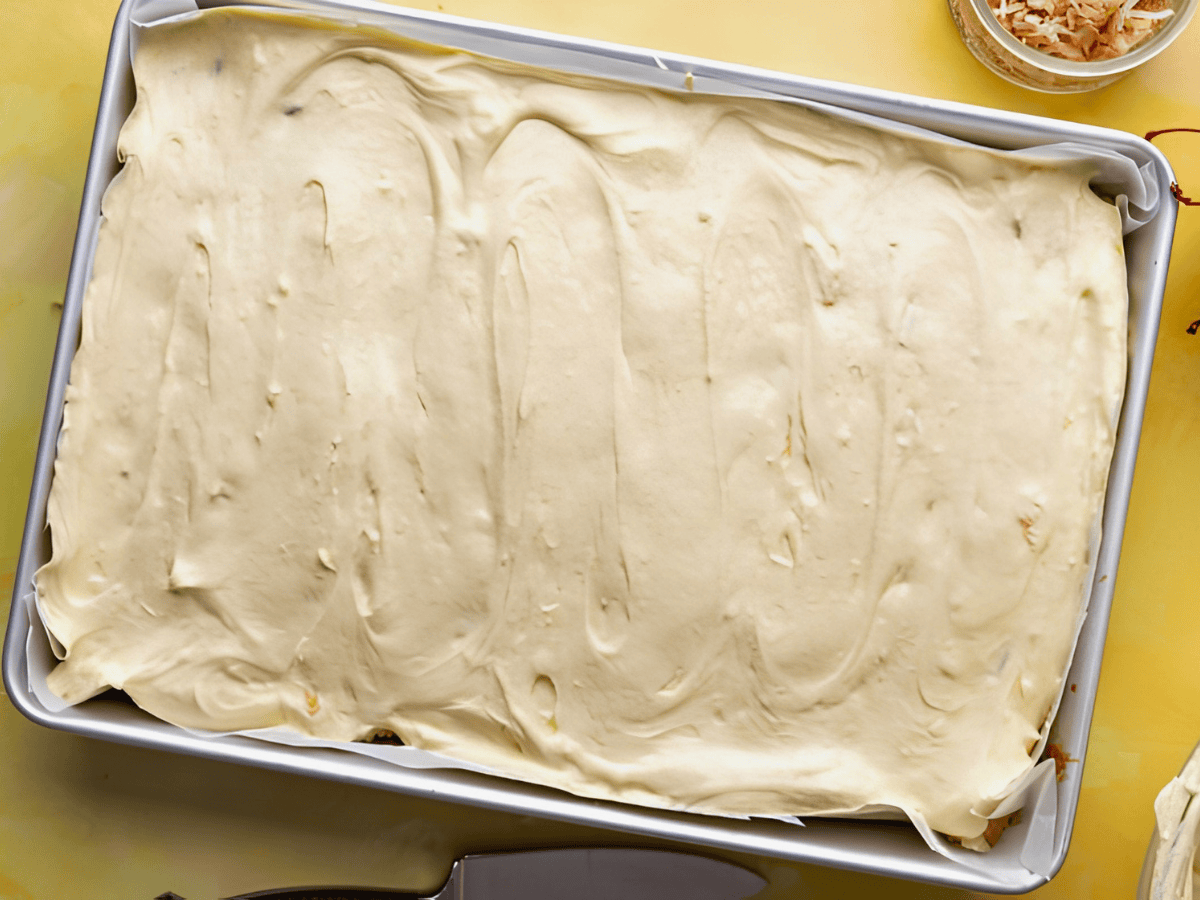 frosting on top of cake in cake pan
