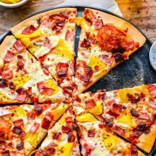 Pizza on a pan with slice cut out