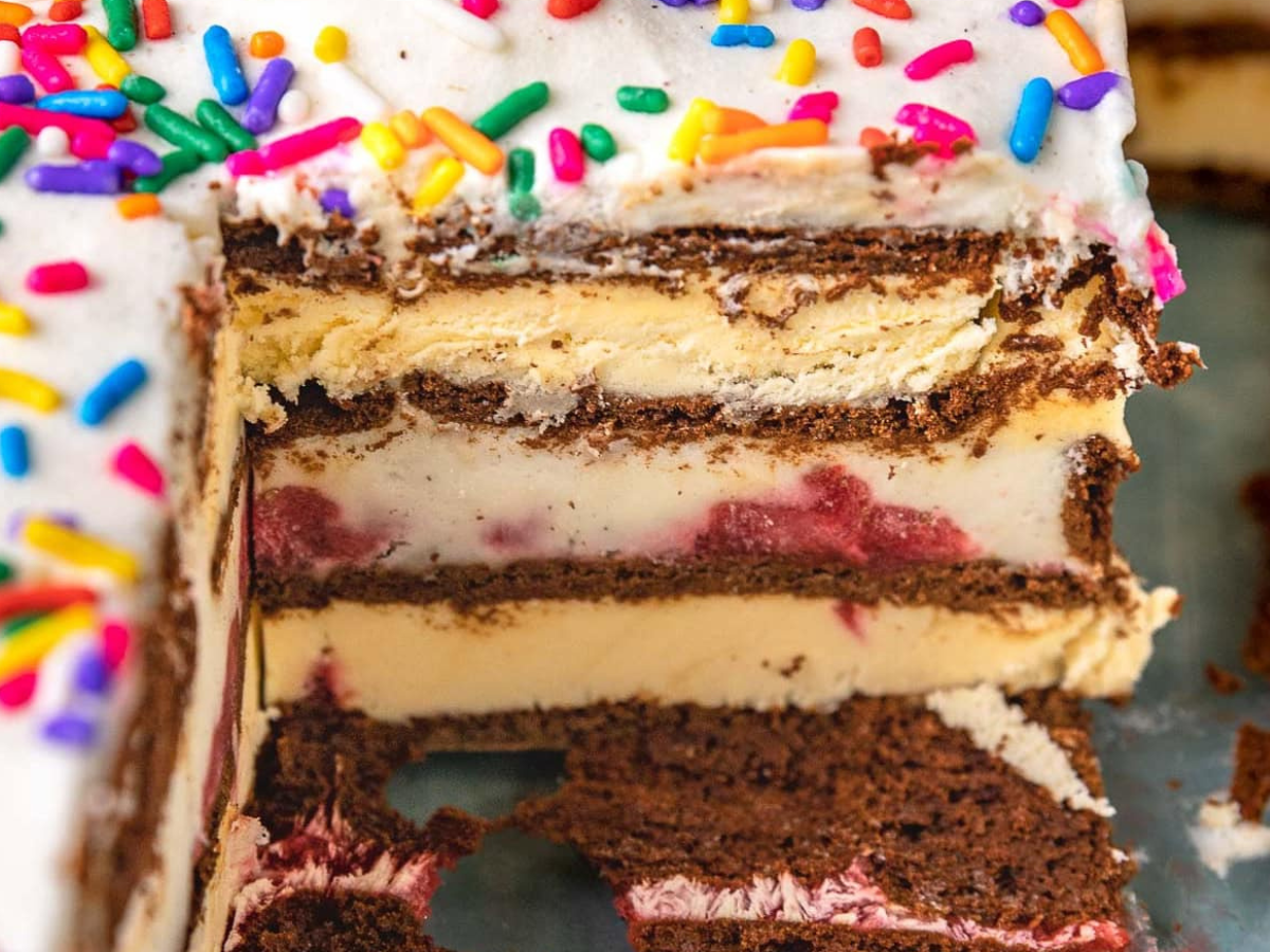 Side view of cake in cake pan with piece removed