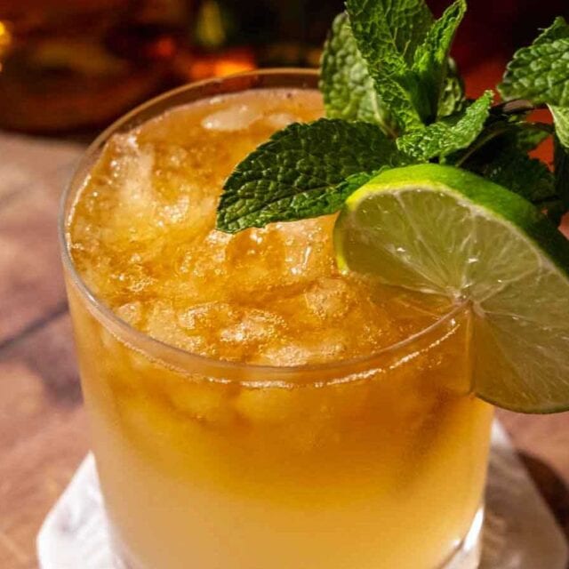 Fruity layered rum drink in cocktail glass.