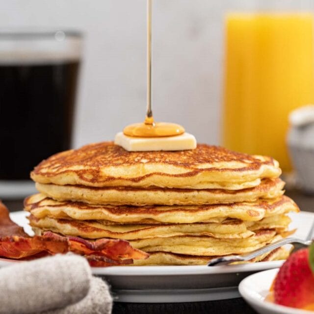 Buttermilk Pancakes on plate with orange juice,