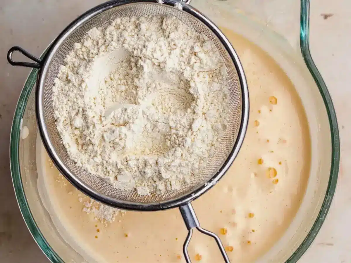 Flour sifted into batter