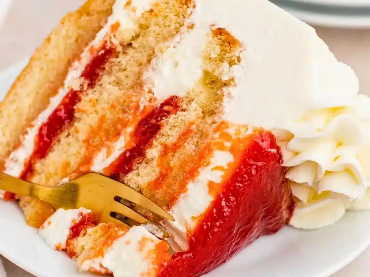 Fork cutting into layer cake
