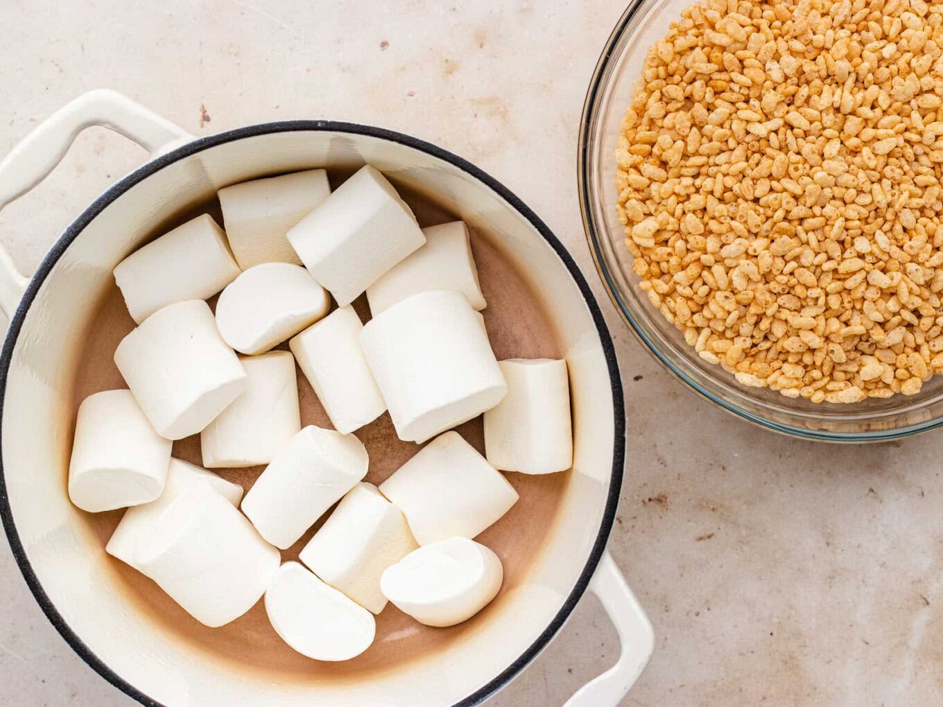 marshmallows and butter in large Dutch oven. Cereal in mixing bowl.