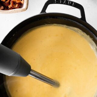 Ultimate Potato Soup blending the potatoes with a hand blender