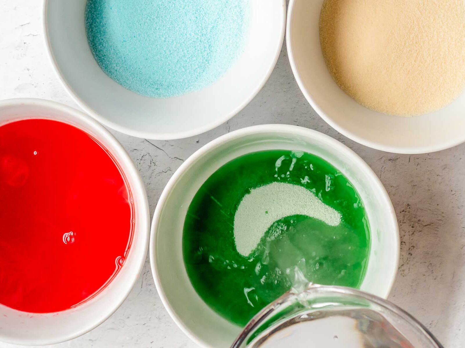 Hot water being mixed into gelatin for Jello Shots