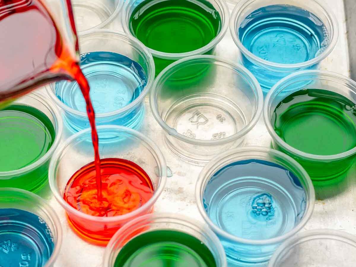 Jello Shots liquid mixture being poured into serving cups