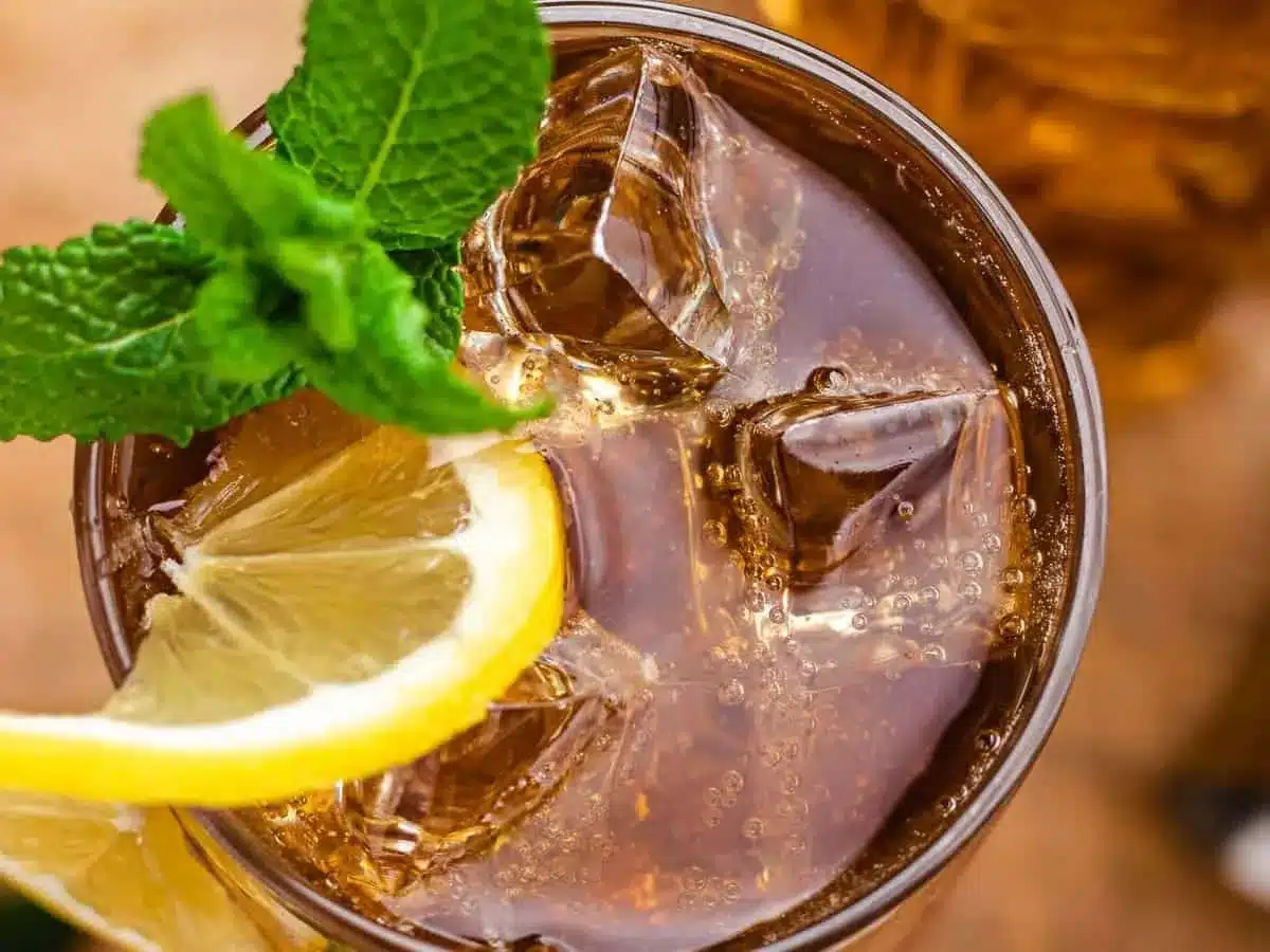 top view of iced drink with lemon and garnish