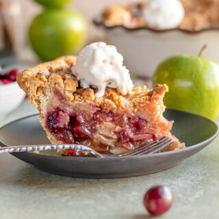 Slice of pie on dessert plate with fork.