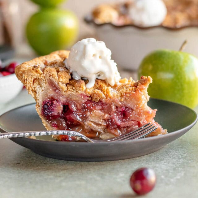 Slice of pie on dessert plate with fork.