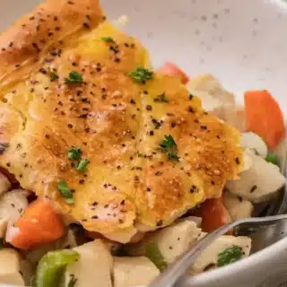 slice of casserole in a bowl with a fork