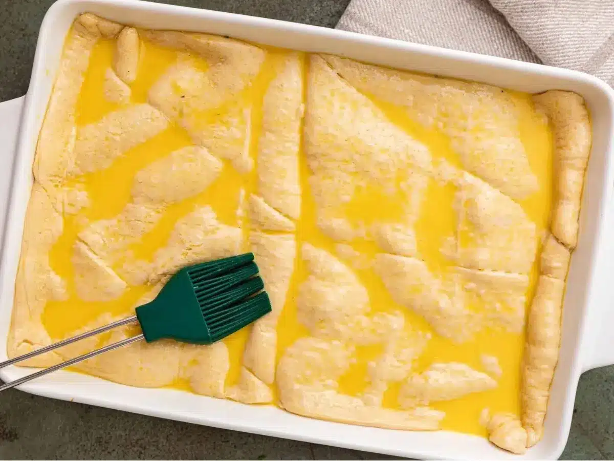 precooked crust with egg wash on top of other ingredients