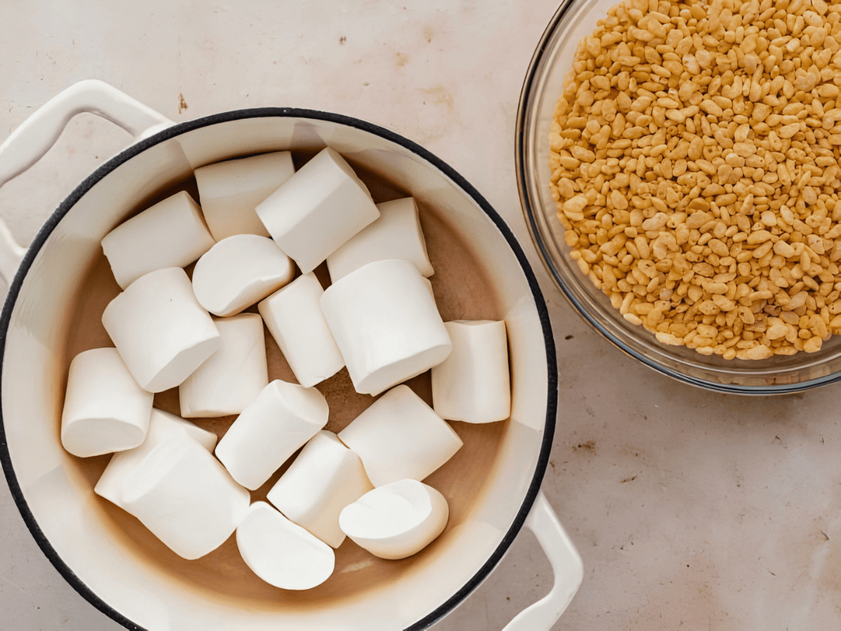 marshmallows in a pot and rice krispies in a bowl