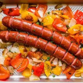 sausage and peppers on a sheet tray