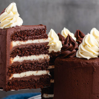 Large slice of tuxedo cake on a serving knife.